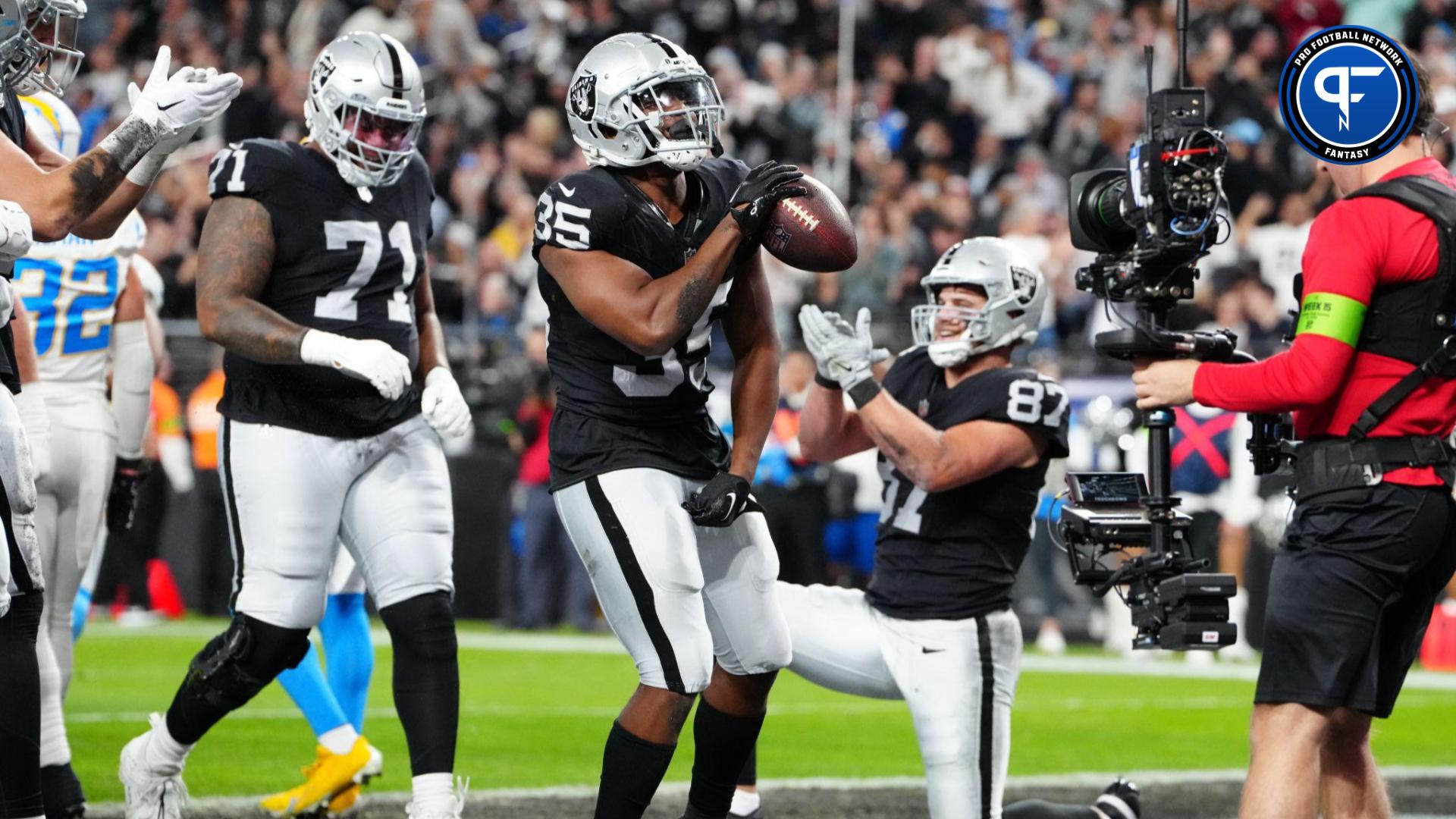 Las Vegas Raiders running back Zamir White (35) celebrates after scoring a touchdown against the Los Angeles Chargers in the first quarter at Allegiant Stadium.