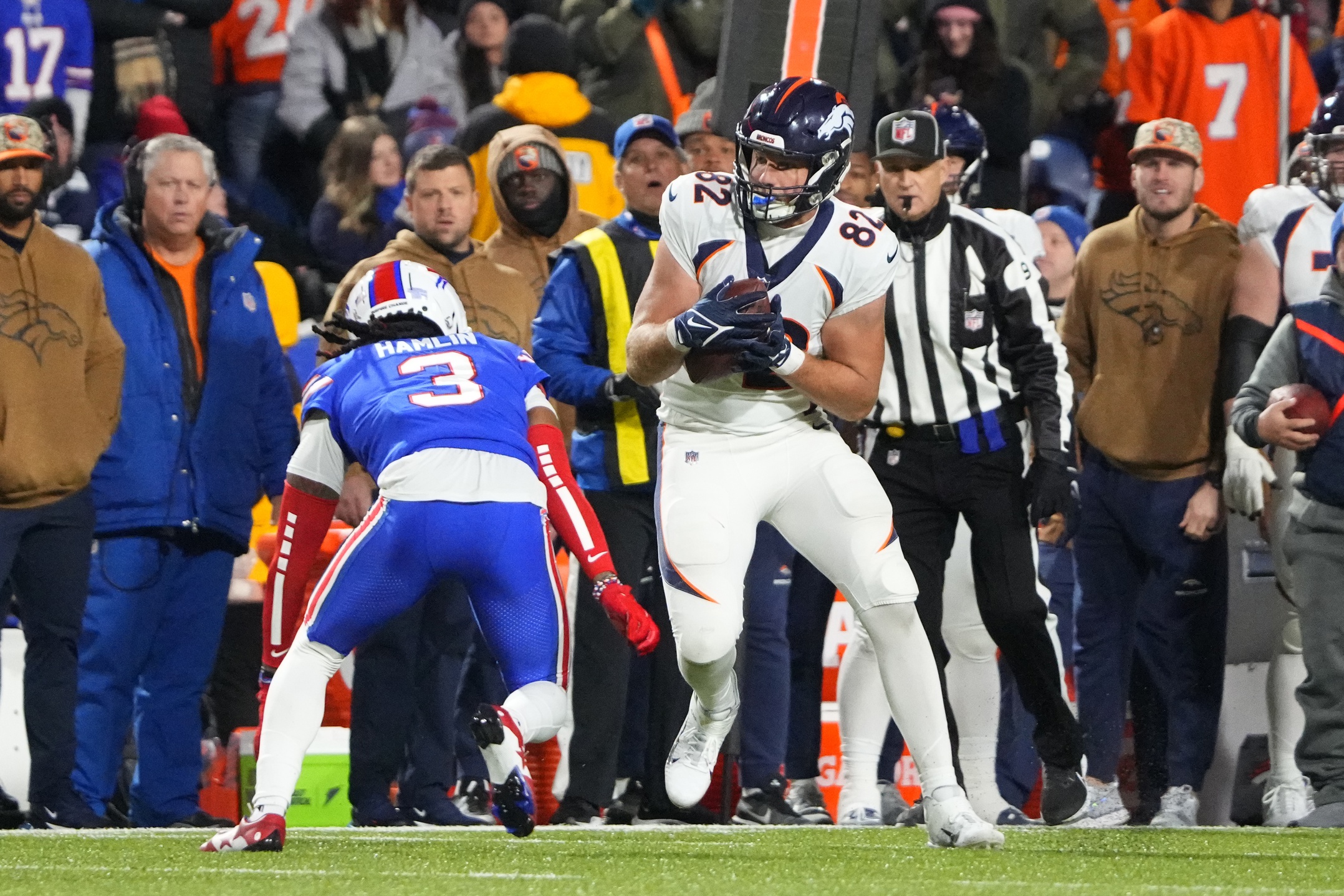 Denver Broncos tight end Adam Trautman (82) makes a catch against Buffalo Bills safety Damar Hamlin (3) during the second half at Highmark Stadium.