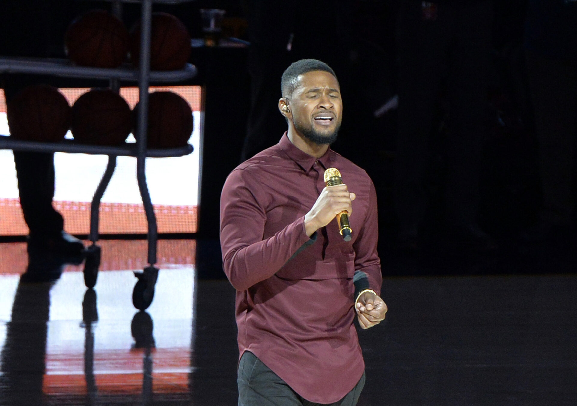 Recording artist Usher performs the national anthem prior to the game between the New York Knicks and the Cleveland Cavaliers at Quicken Loans Arena.