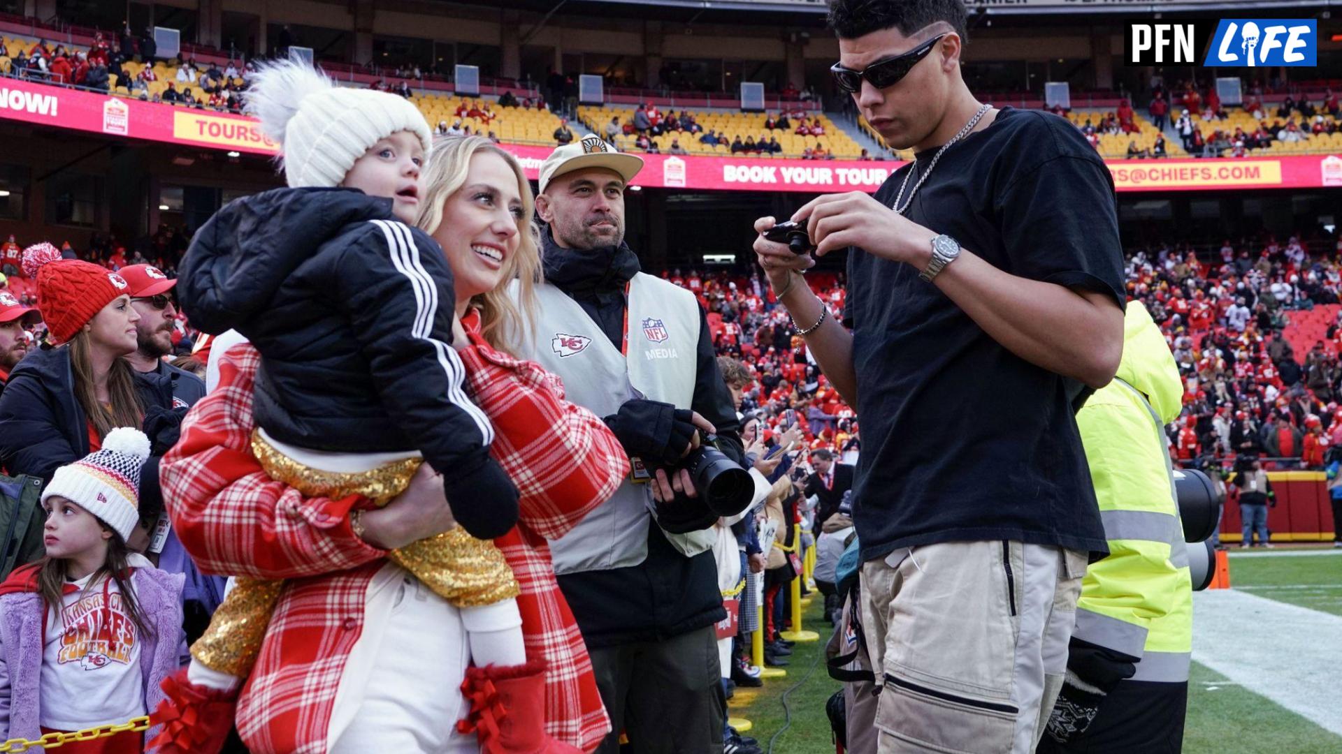 Patrick Mahomes' wife, Brittany, with their daughter, Sterling, and Patrick's brother, Jackson, on the sidelines prior to a game.