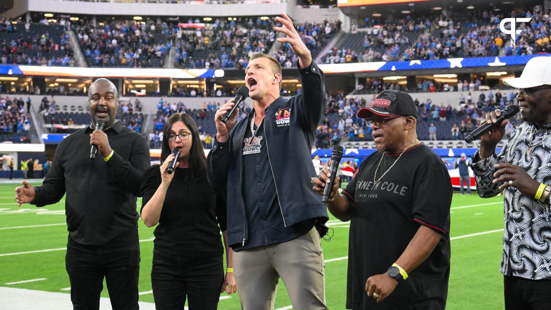 Rob Gronkowski (middle) sings during the National Anthem with the New Directions Veterans Choir before the Starco Brands LA Bowl at SoFi Stadium. Gronkowski is the host of the game.