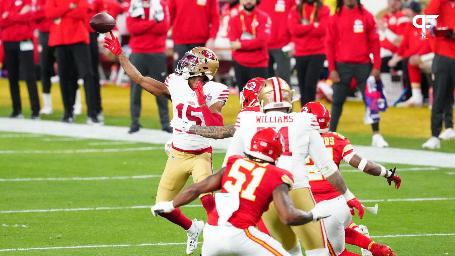 San Francisco 49ers wide receiver Jauan Jennings (15) throws a touchdown pass to running back Christian McCaffrey (not pictured) against the Kansas City Chiefs in the first half in Super Bowl LVIII at Allegiant Stadium.