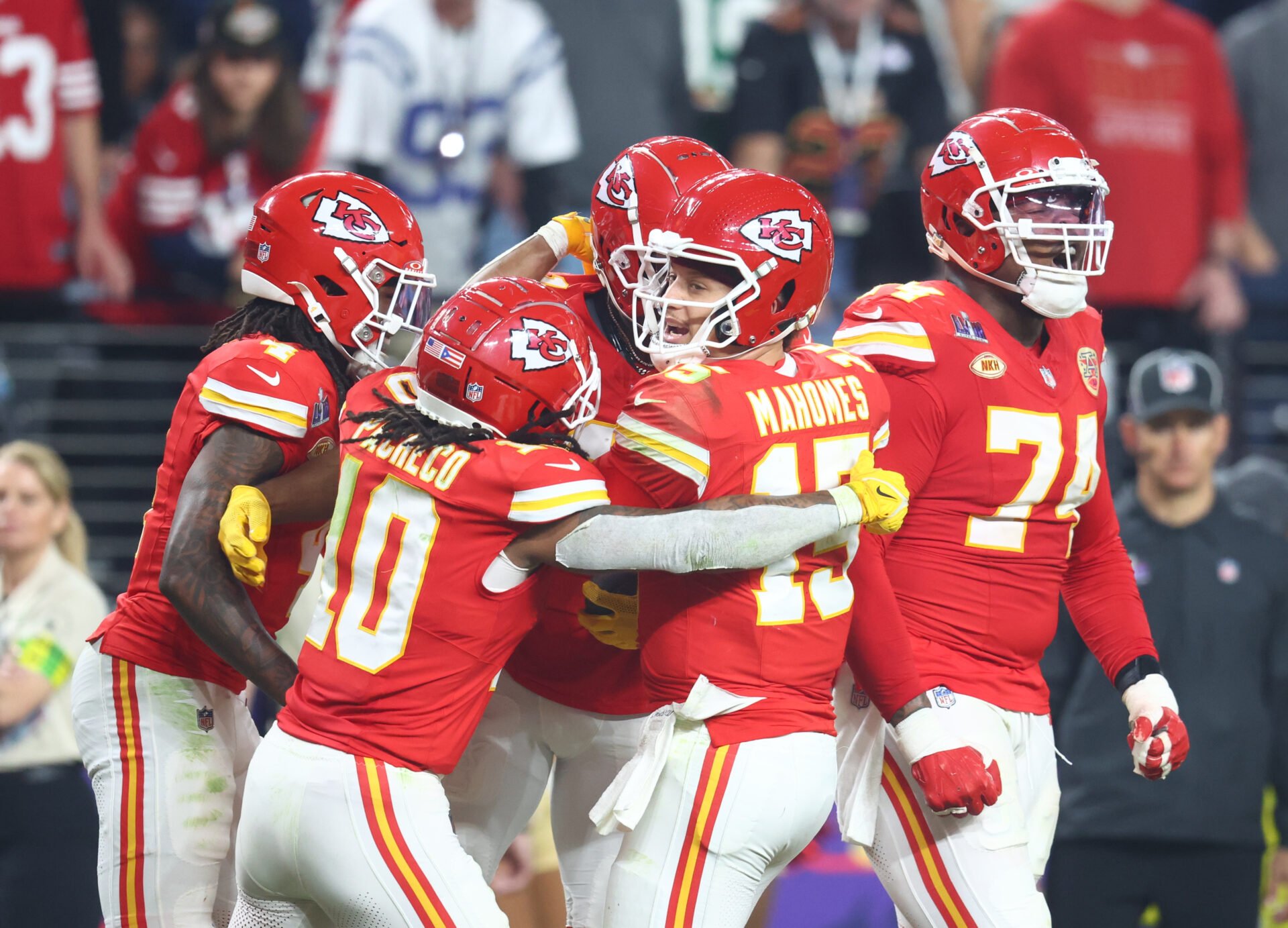 Kansas City Chiefs quarterback Patrick Mahomes (15) celebrates with teammates after a touchown against the San Francisco 49ers in the second half in Super Bowl LVIII at Allegiant Stadium.