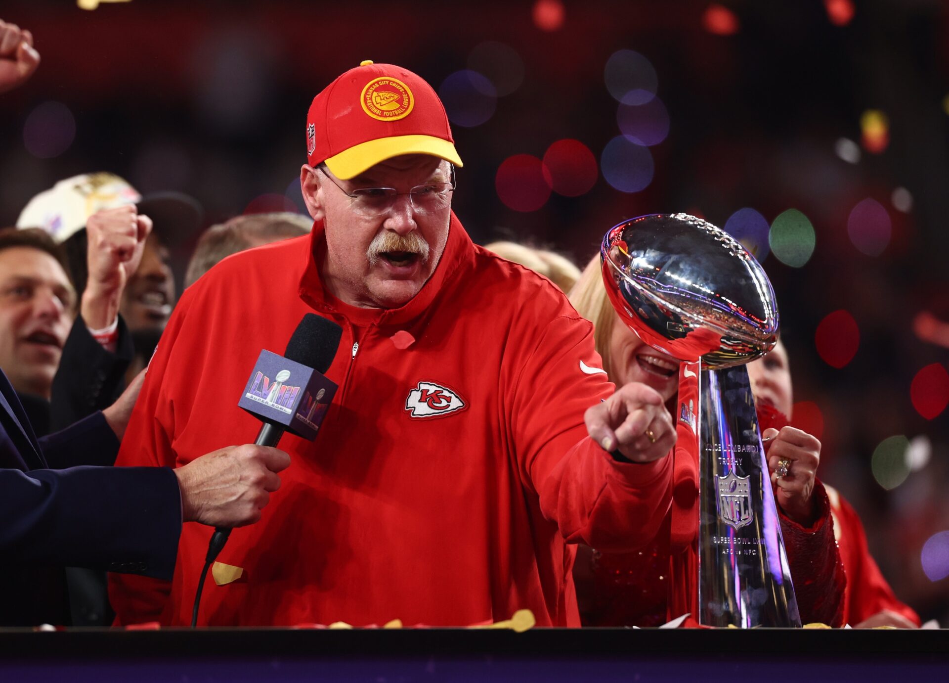 Kansas City Chiefs head coach Andy Reid celebrates with the Vince Lombardi Trophy after defeating the San Francisco 49ers in Super Bowl LVIII at Allegiant Stadium.