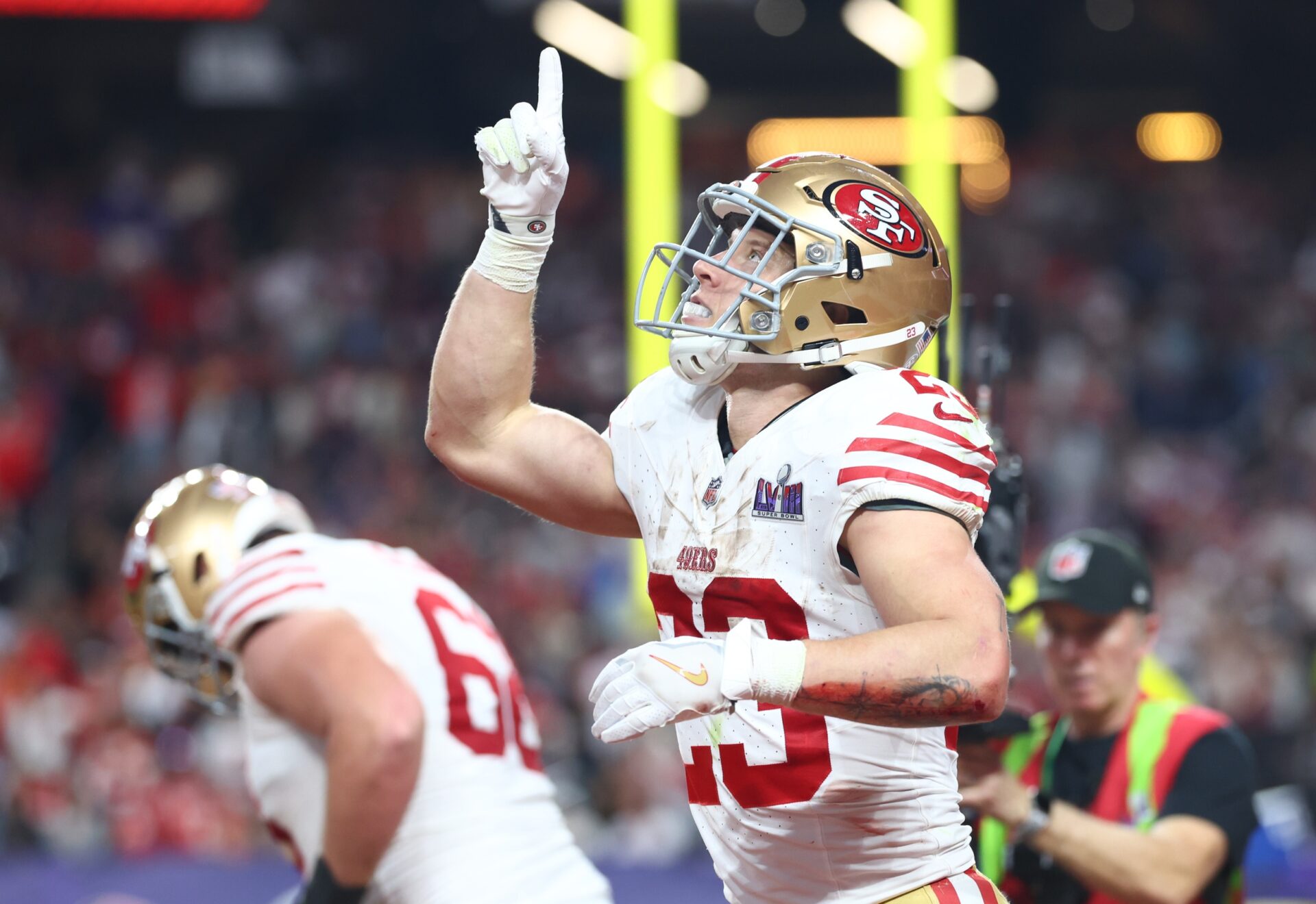 San Francisco 49ers running back Christian McCaffrey (23) scores a touchdown against the Kansas City Chiefs in the first half of Super Bowl LVIII at Allegiant Stadium.