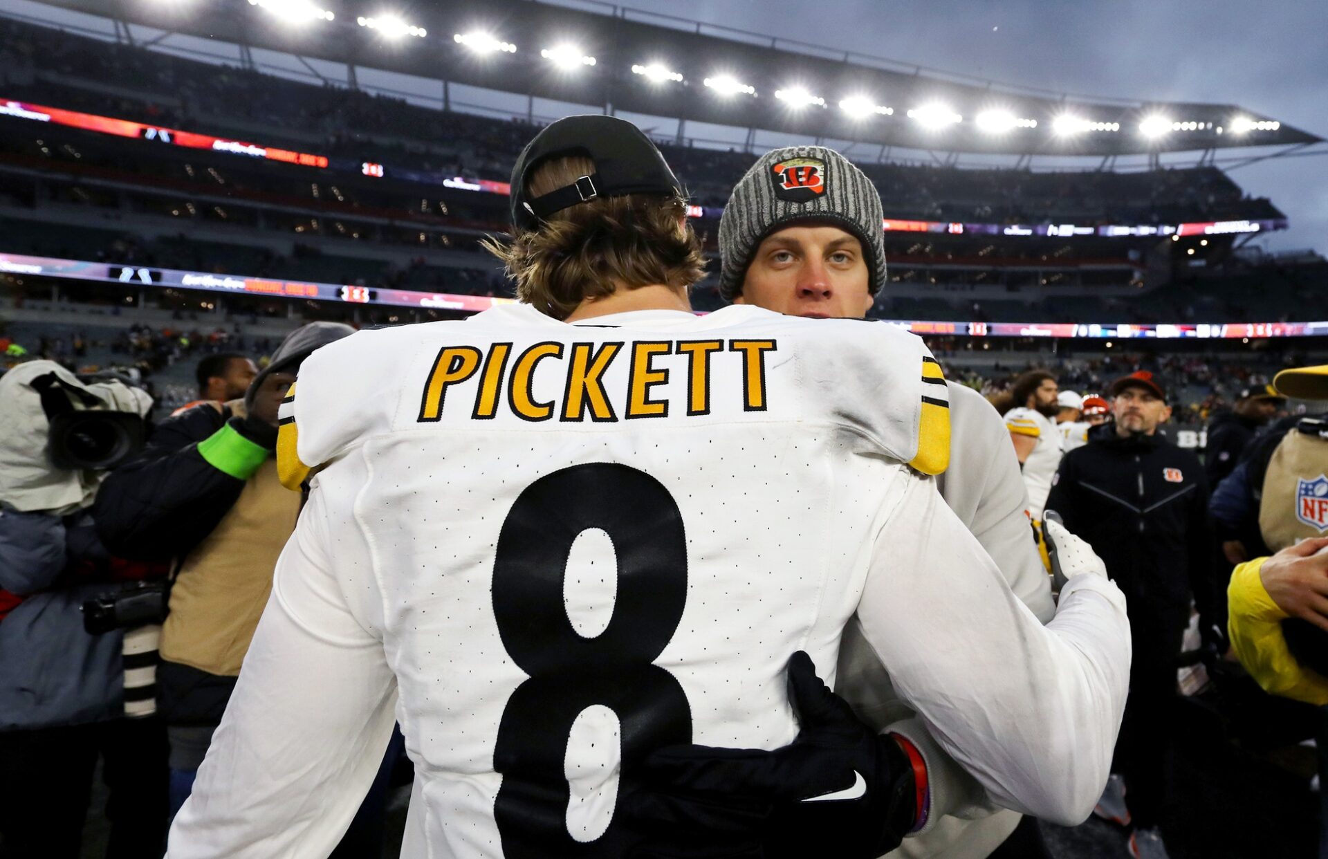 Pittsburgh Steelers quarterback Kenny Pickett (8) and Cincinnati Bengals quarterback Joe Burrow (9) meet after the game at Paycor Stadium.