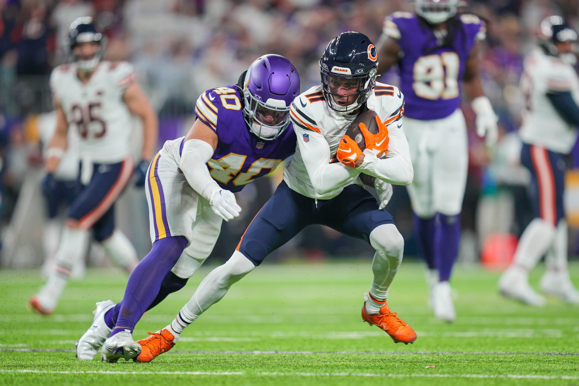 Chicago Bears wide receiver Darnell Mooney (11) runs after the catch against the Minnesota Vikings linebacker Ivan Pace Jr. (40) in the fourth quarter at U.S. Bank Stadium.