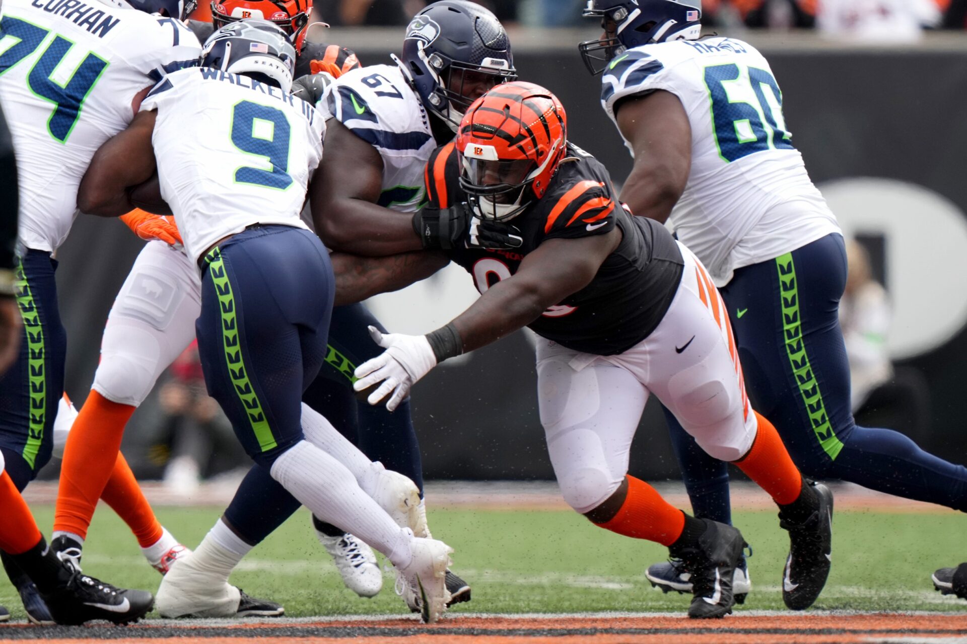 Cincinnati Bengals defensive tackle DJ Reader (98) looks to tackle Seattle Seahawks running back Kenneth Walker III (9) in the second quarter during an NFL football game between the Seattle Seahawks and the Cincinnati Bengals Sunday, Oct. 15, 2023, at Paycor Stadium in Cincinnati.