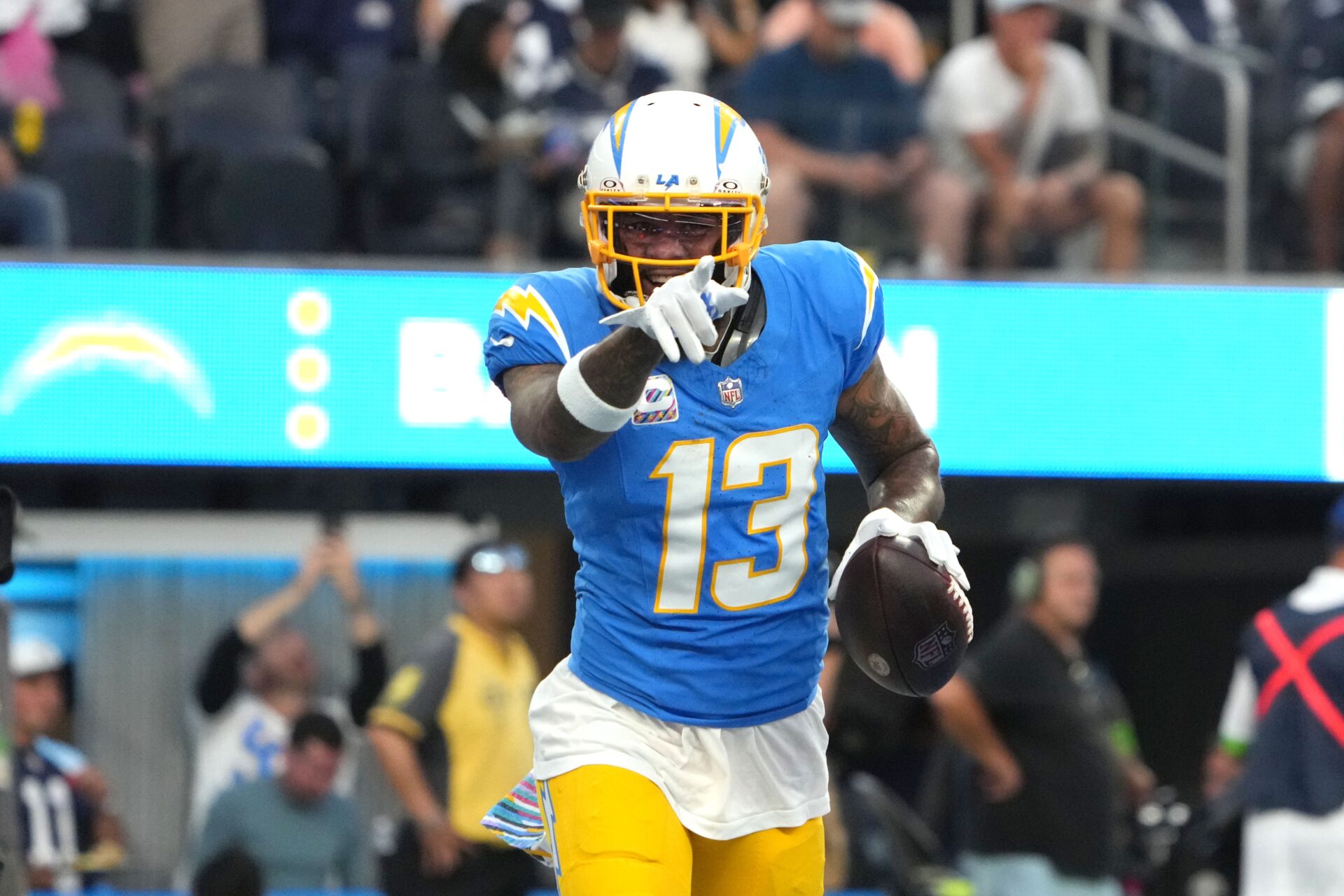 Los Angeles Chargers wide receiver Keenan Allen (13) celebrates after scoring on a 1-yard touchdown reception against the Dallas Cowboys in the first half at SoFi Stadium.