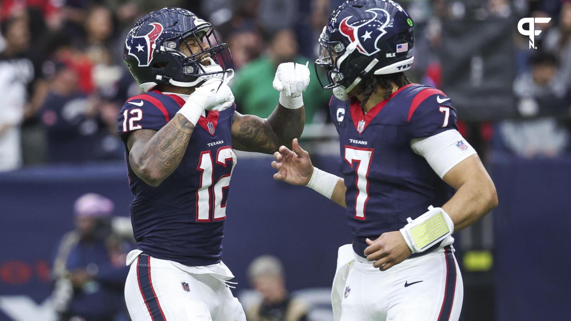 Houston Texans QB C.J. Stroud (7) and WR Nico Collins (12) celebrate after a touchdown against the Cleveland Browns.