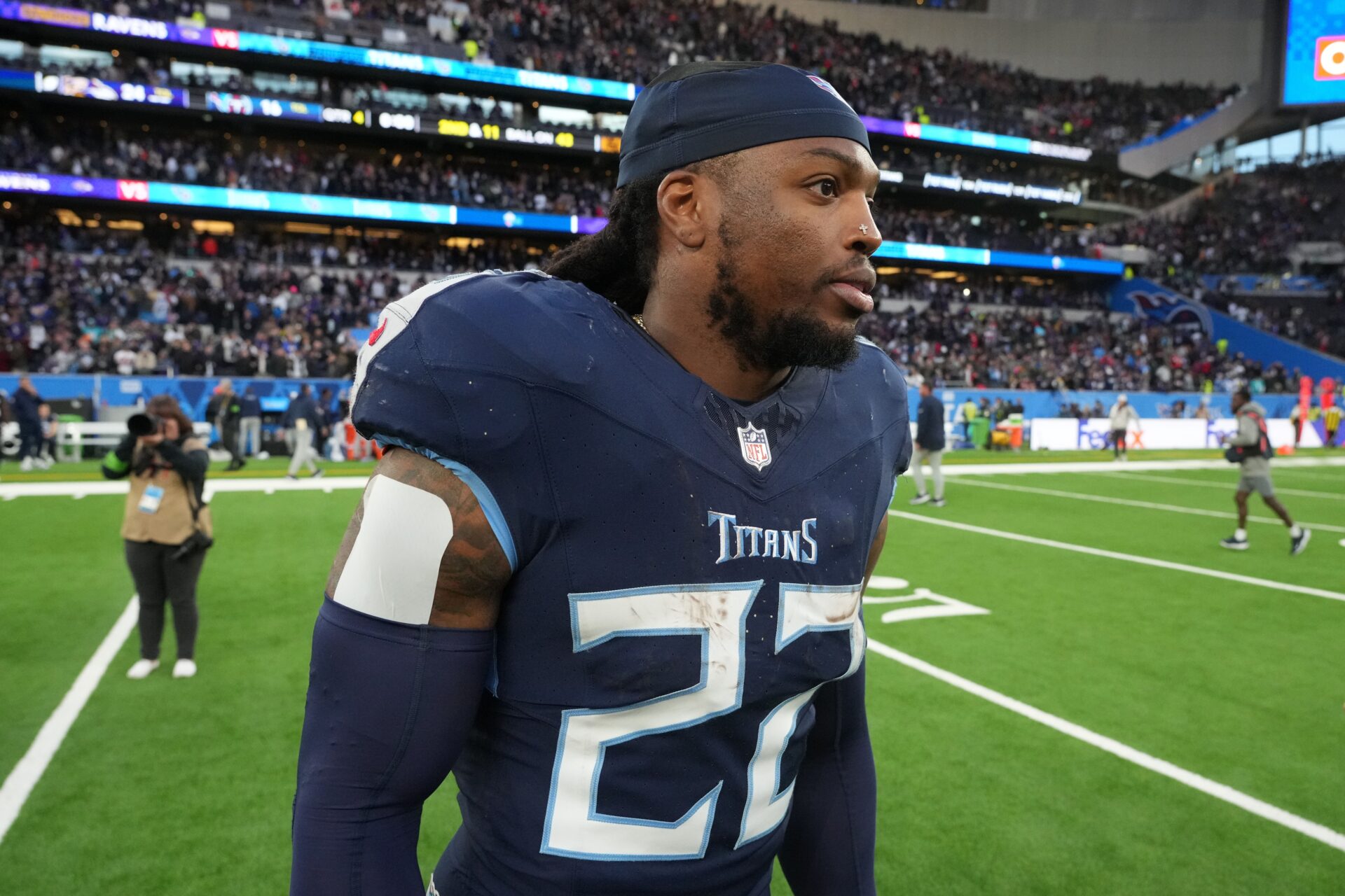 Tennessee Titans running back Derrick Henry (22) leaves the field after an NFL International Series game against the Baltimore Ravens at Tottenham Hotspur Stadium.