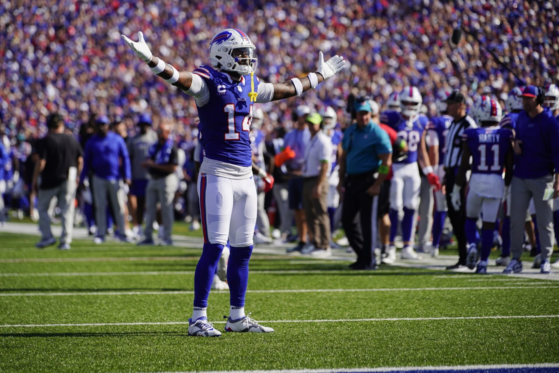 Buffalo Bills wide receiver Stefon Diggs (14) reacts to the crowd for scoring a touchdown against the Miami Dolphins during the second half at Highmark Stadium.