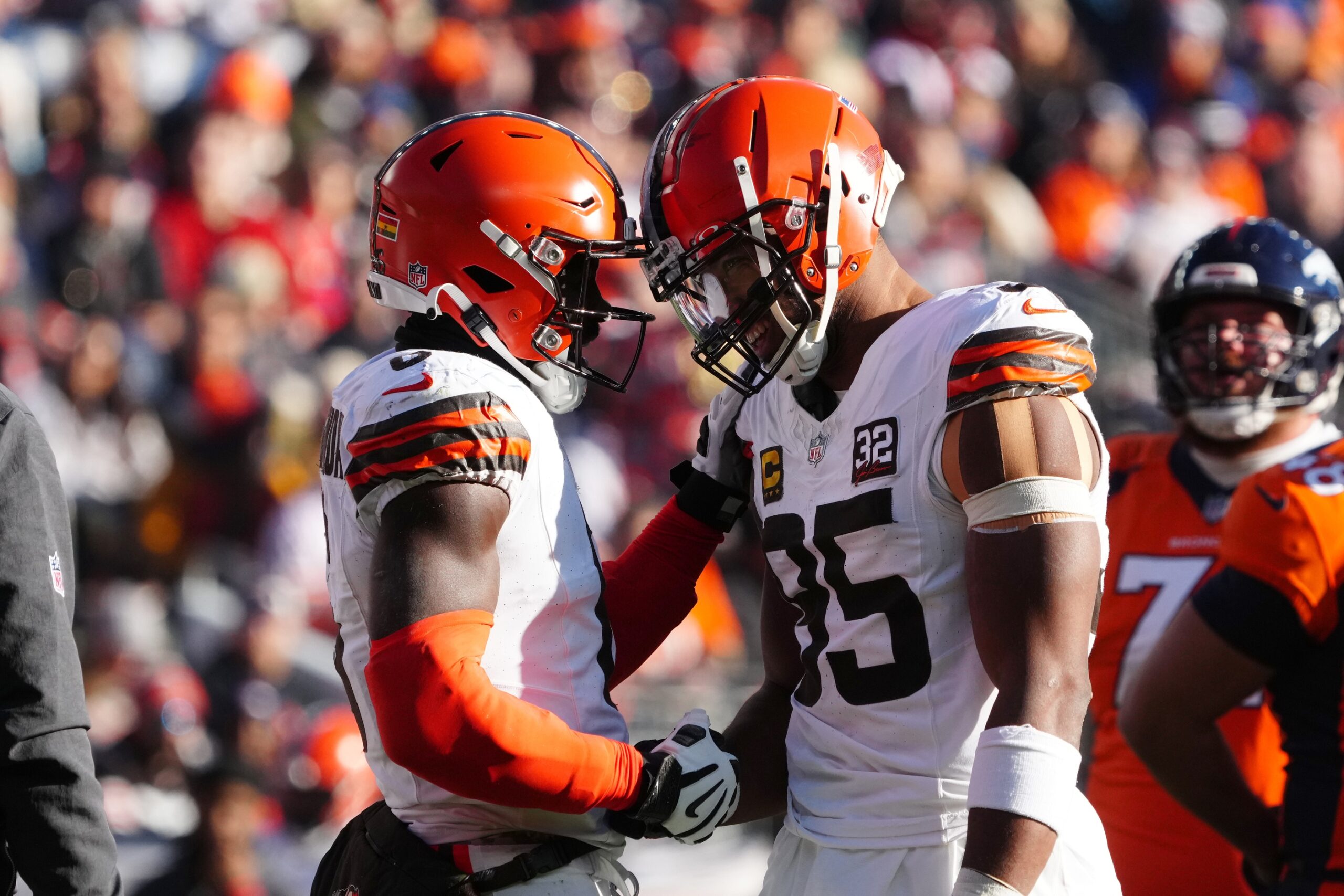 Cleveland Browns defensive end Myles Garrett (95) and linebacker Anthony Walker Jr. (5) during the first quarter against the Denver Broncos at Empower Field at Mile High. Mandatory Credit: Ron Chenoy-USA TODAY Sports