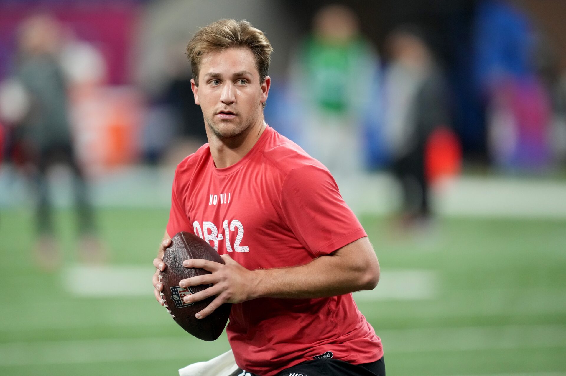 Mar 2, 2024; Indianapolis, IN, USA; Brigham Young quarterback Kedon Slovis (QB12) during the 2024 NFL Combine at Lucas Oil Stadium. Mandatory Credit: Kirby Lee-USA TODAY Sports