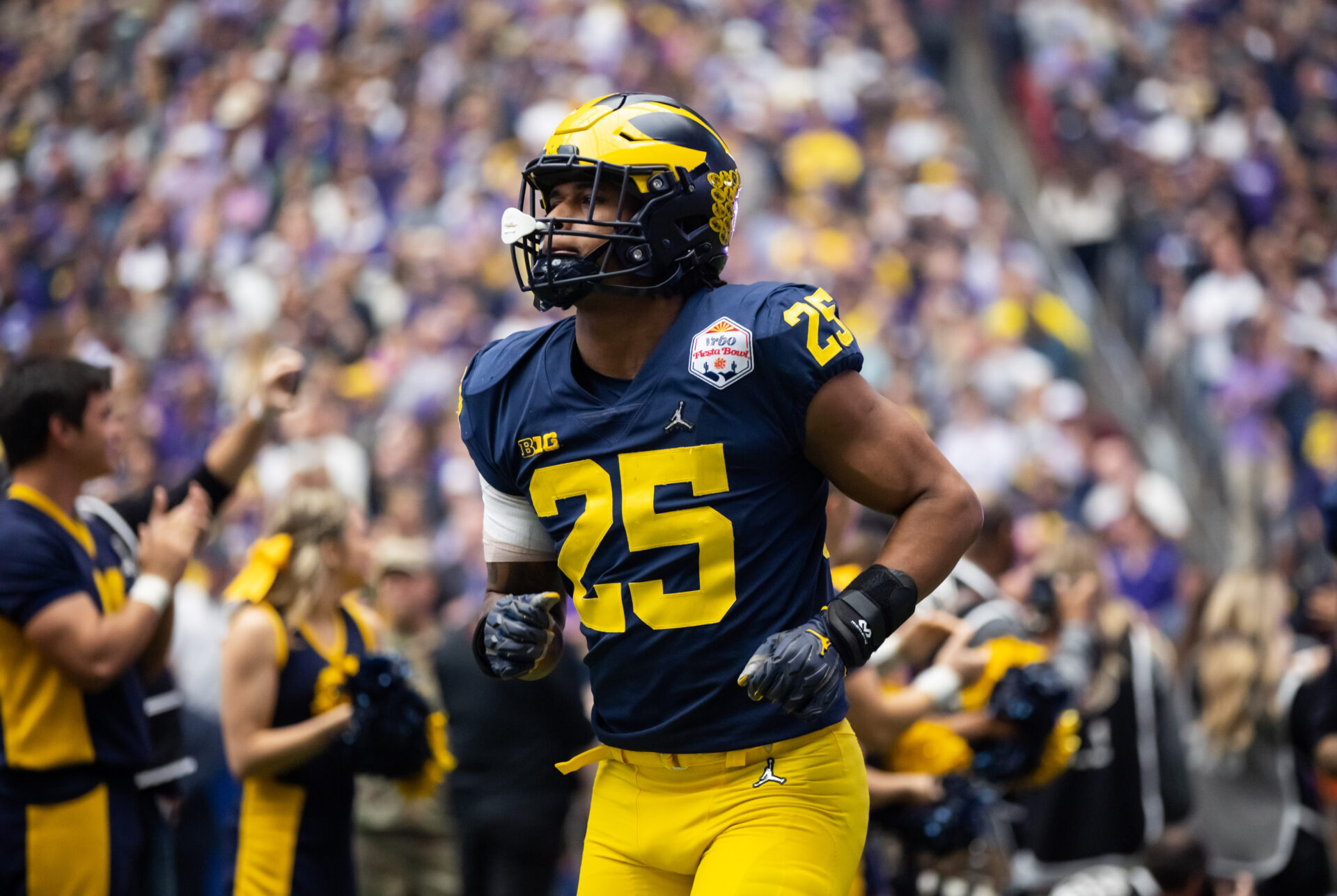 Michigan Wolverines linebacker Junior Colson (25) against the TCU Horned Frogs during the 2022 Fiesta Bowl at State Farm Stadium.