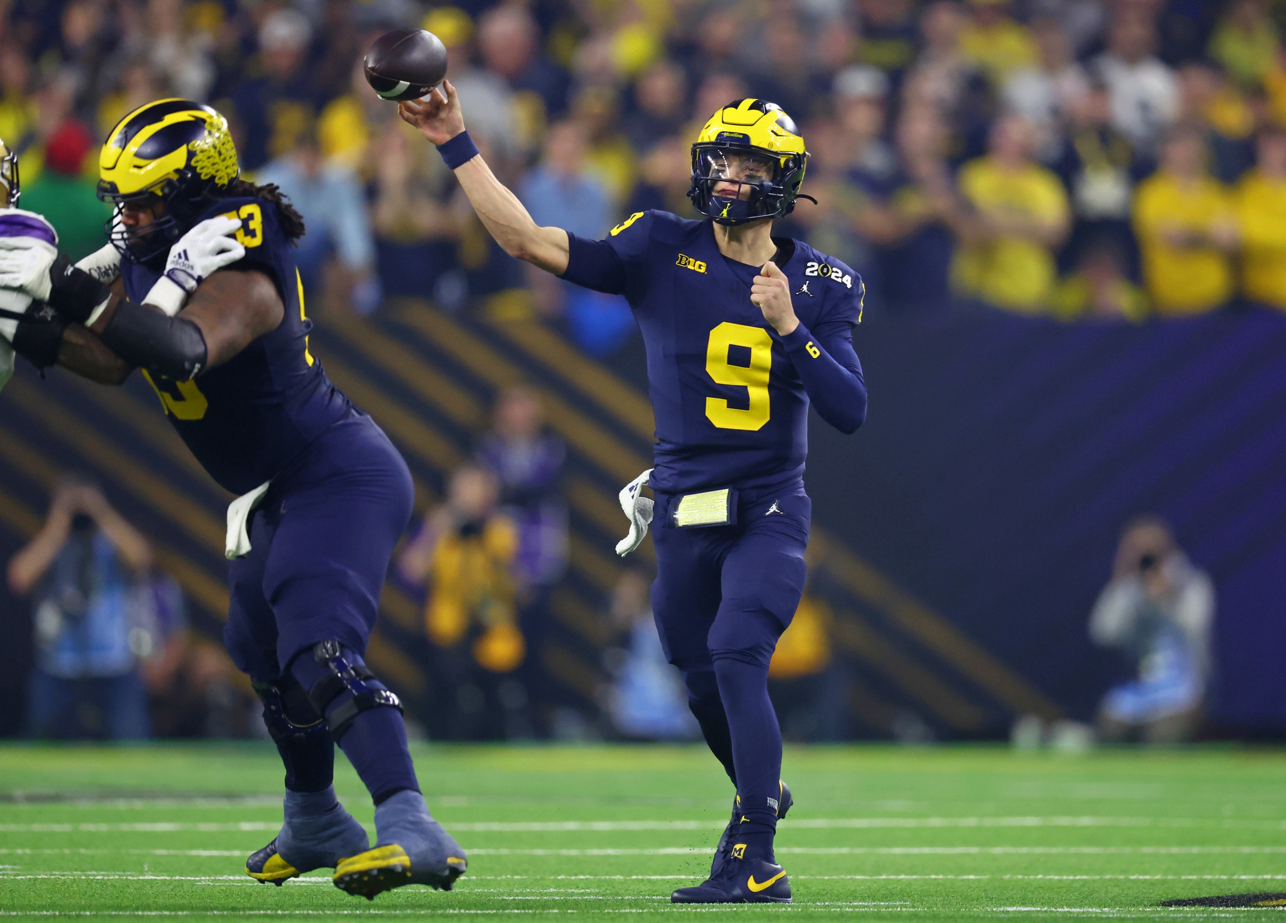 Michigan Wolverines quarterback J.J. McCarthy (9) passes the ball against the Washington Huskies during the first quarter in the 2024 College Football Playoff national championship game at NRG Stadium. Mandatory Credit: Mark J. Rebilas-USA TODAY Sports