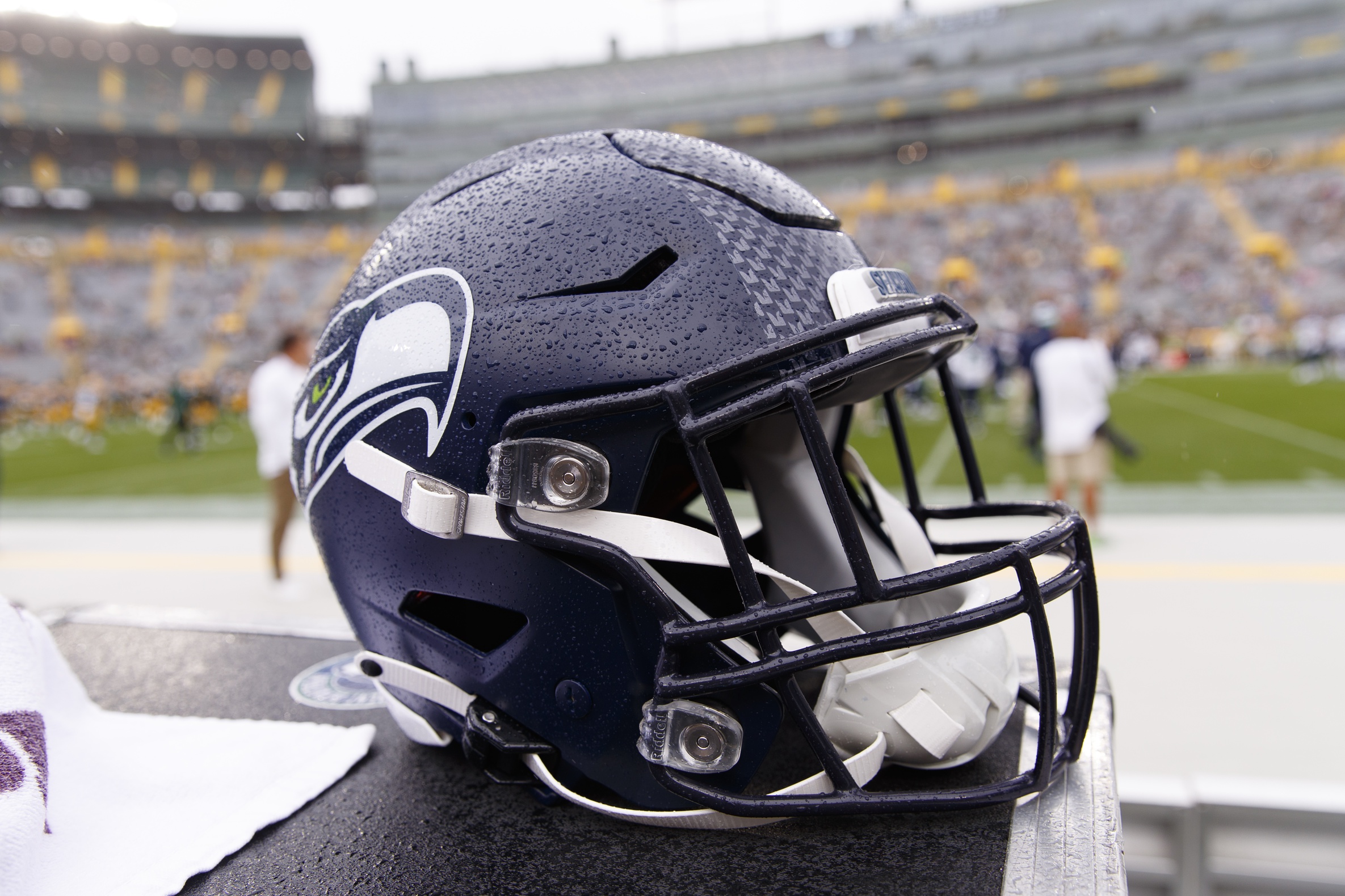 A Seattle Seahawks helmet sits on the sidelines during warmups prior to the game against the Green Bay Packers at Lambeau Field.