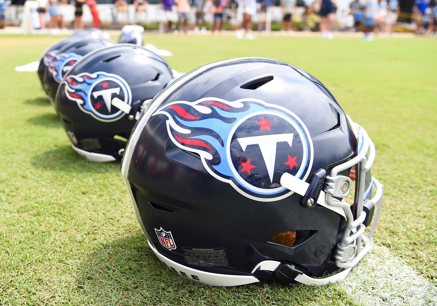 View of helmets on the field as Tennessee Titans players finish training camp practice.