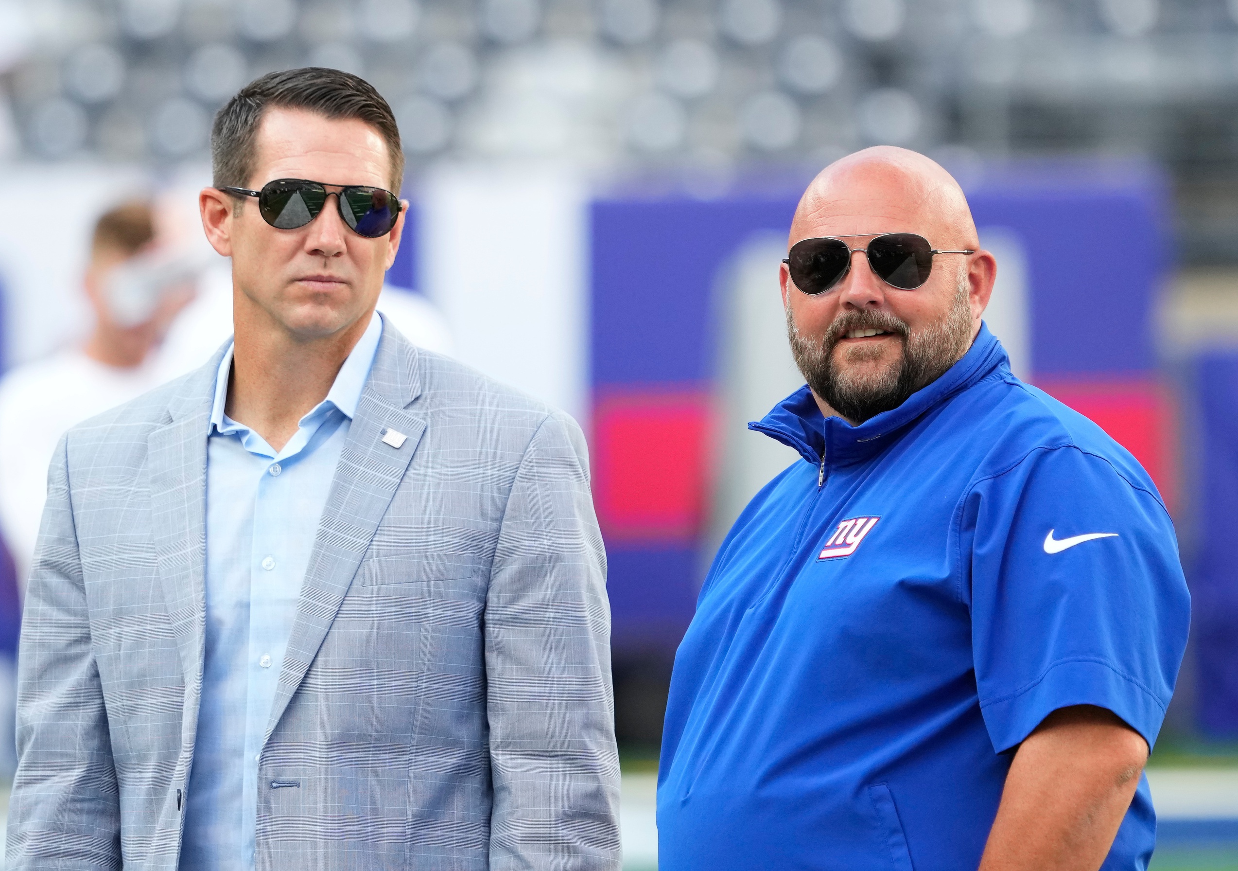 New York Giants head coach Brian Daboll (right) and general manager Joe Schoen (left) talk before a game against the New York Jets at MetLife Stadium.