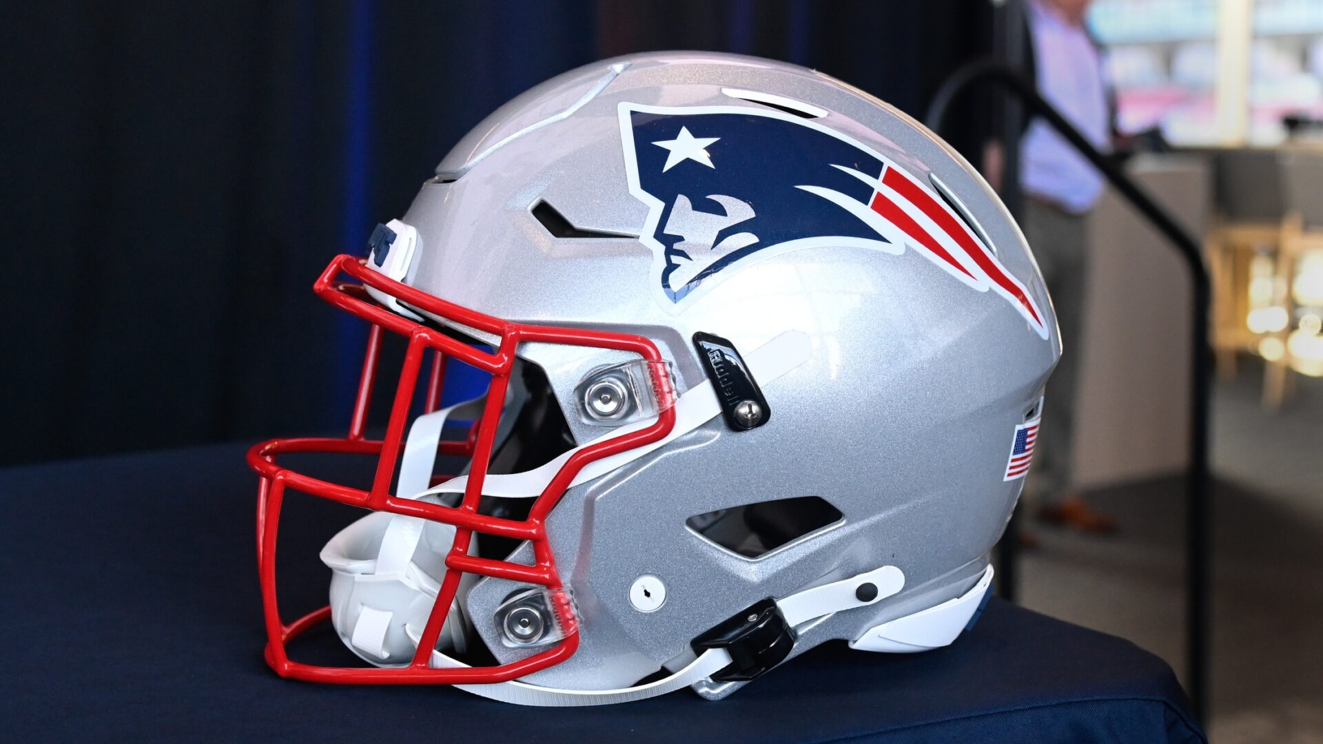 A New England Patriots helmet sits on a table prior to a press conference at Gillette Stadium.
