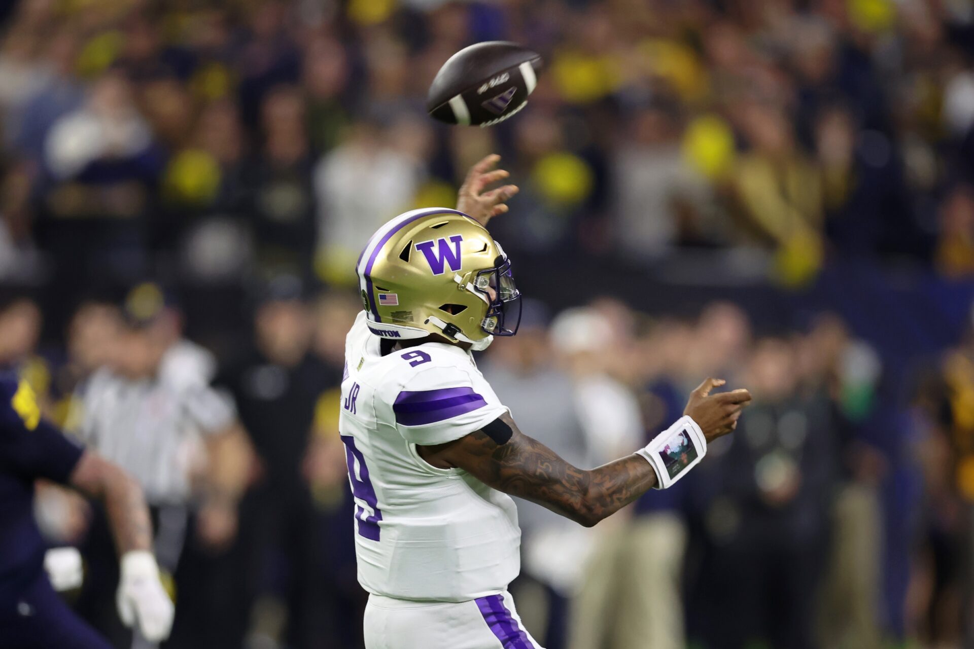 Washington Huskies quarterback Michael Penix Jr. (9) passes the ball against the Michigan Wolverines during the fourth quarter in the 2024 College Football Playoff national championship game at NRG Stadium.