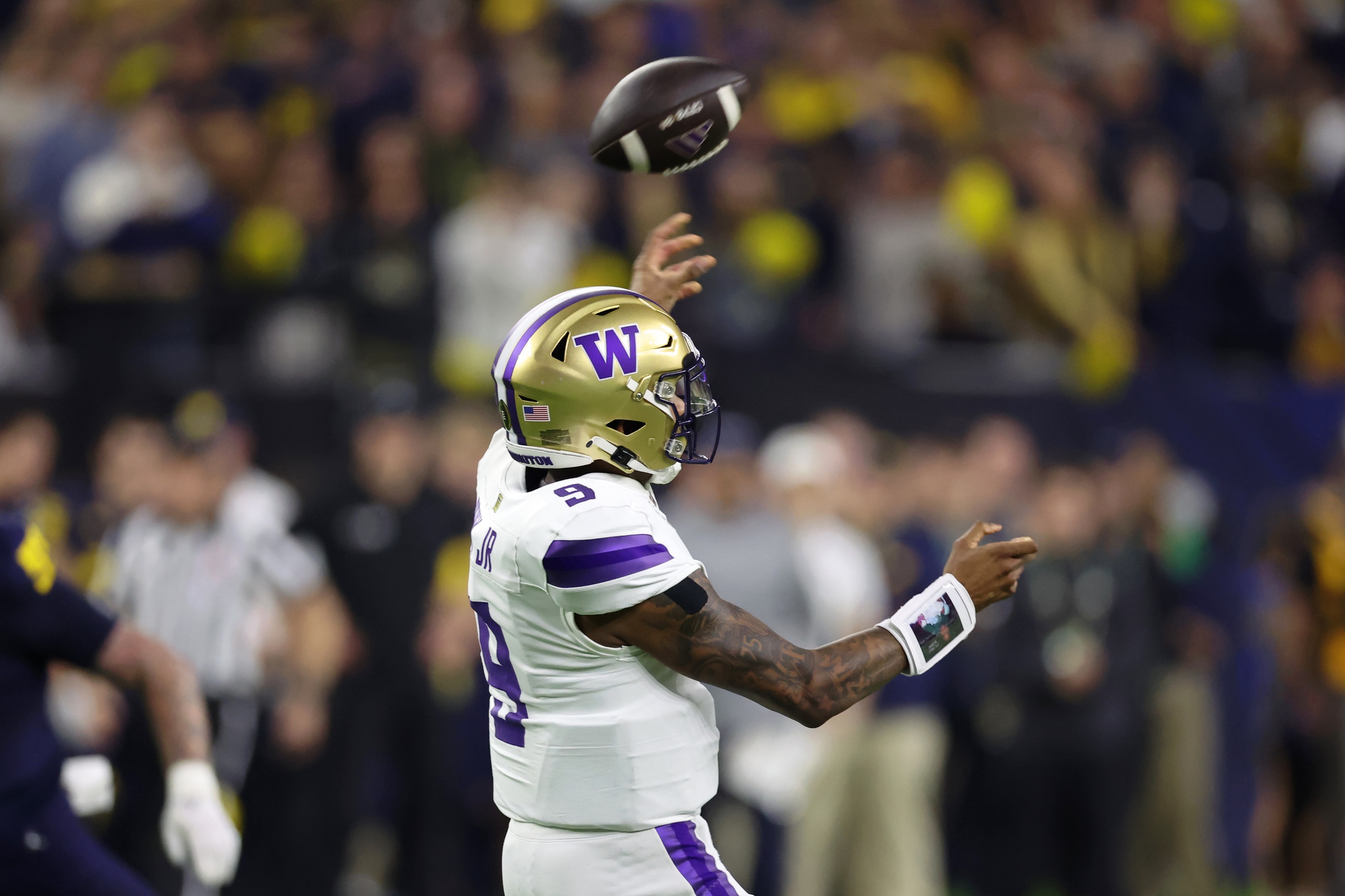 Washington Huskies quarterback Michael Penix Jr. (9) passes the ball against the Michigan Wolverines during the fourth quarter in the 2024 College Football Playoff national championship game at NRG Stadium.