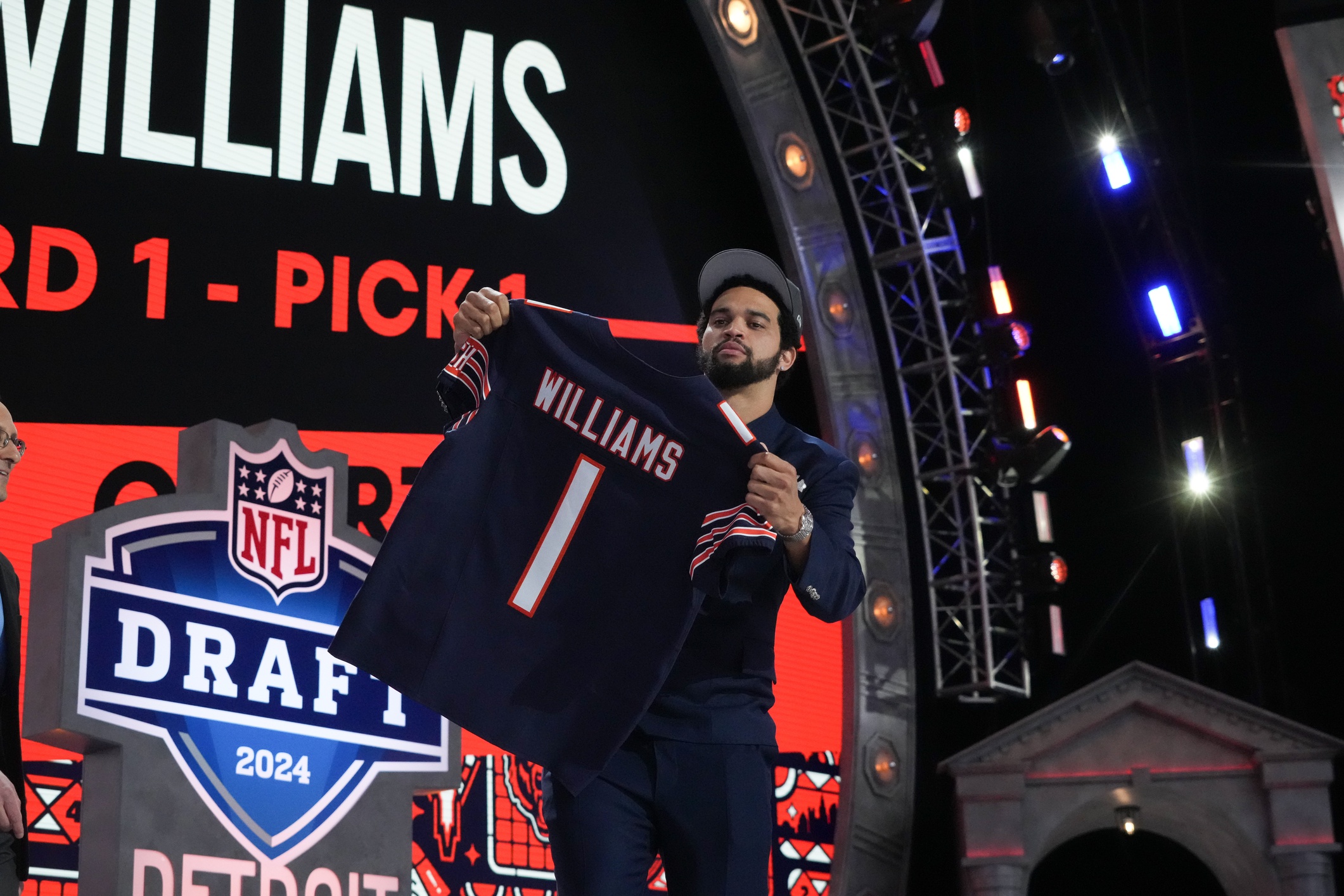 Southern California Trojans quarterback Caleb Williams holds up his jersey after being selected by the Chicago Bears as the No. 1 pick in the first round of the 2024 NFL Draft at Campus Martius Park and Hart Plaza. Mandatory Credit: Kirby Lee-USA TODAY Sports