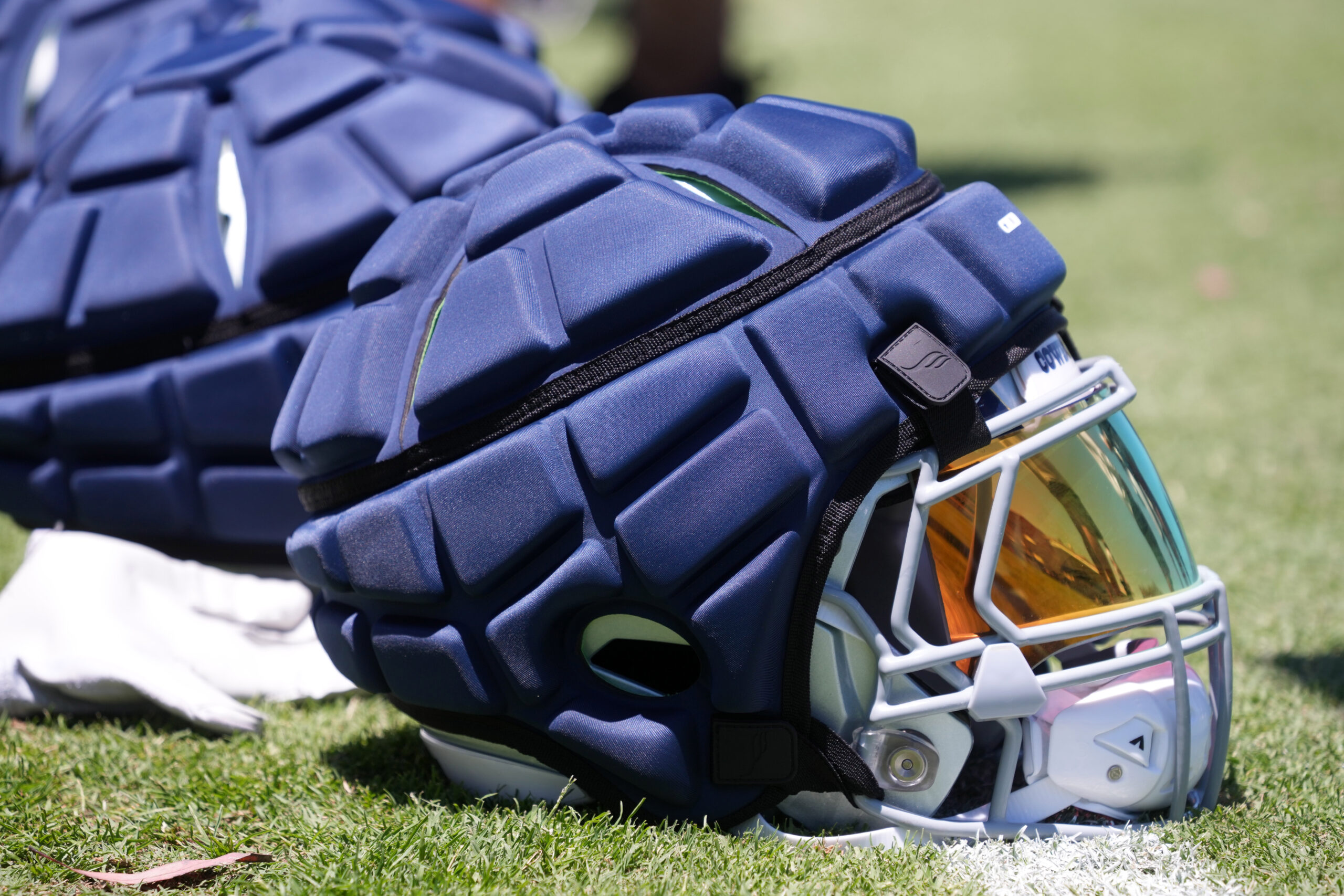 Dallas Cowboys helmets with Guardian helmet caps during training camp at Marriott Residence Inn-River Ridge Playing Fields.