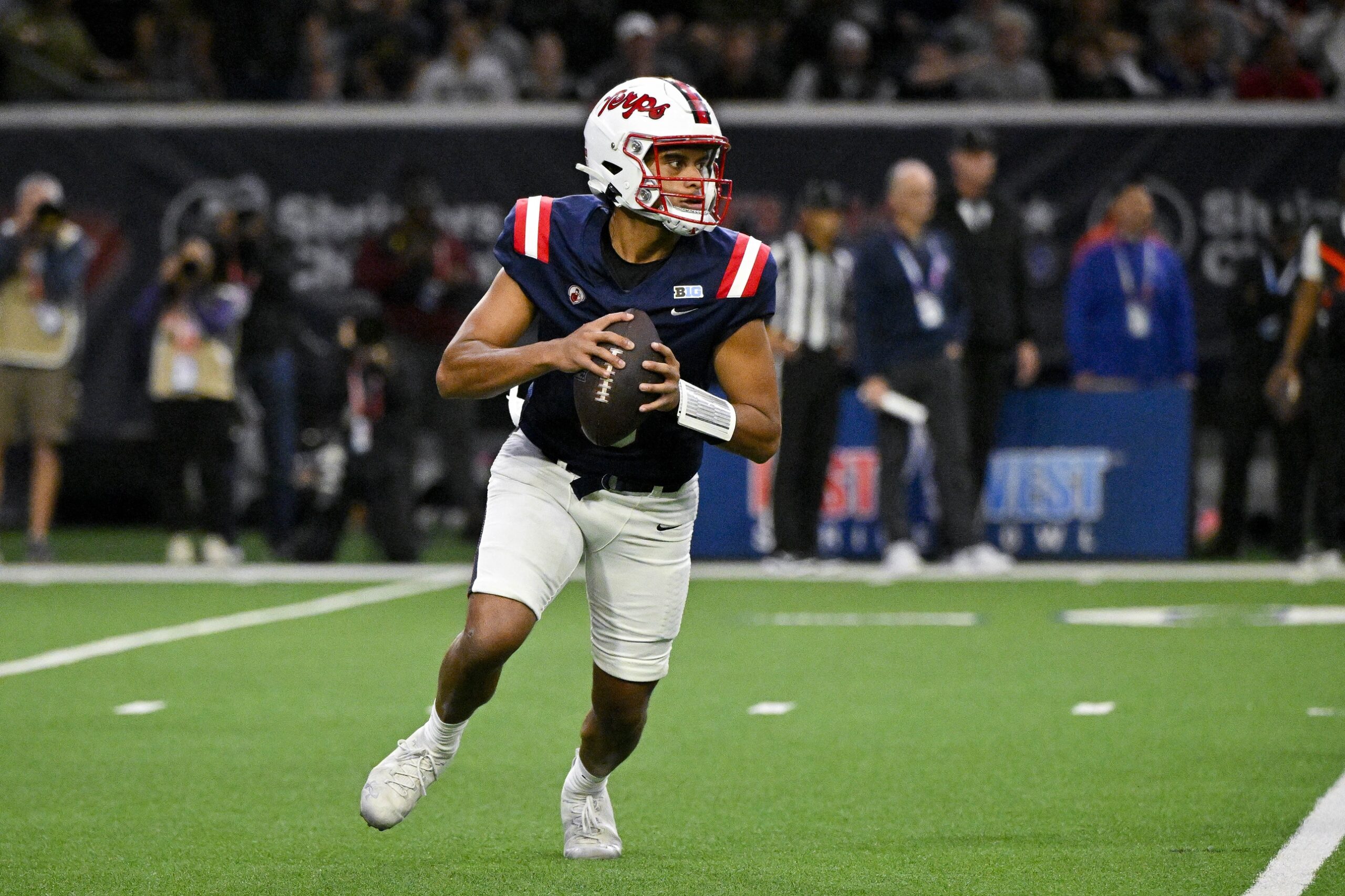 West quarterback Taulia Tagovailoa of Maryland (5) runs with the ball during the first half against the East at the Ford Center at The Star.