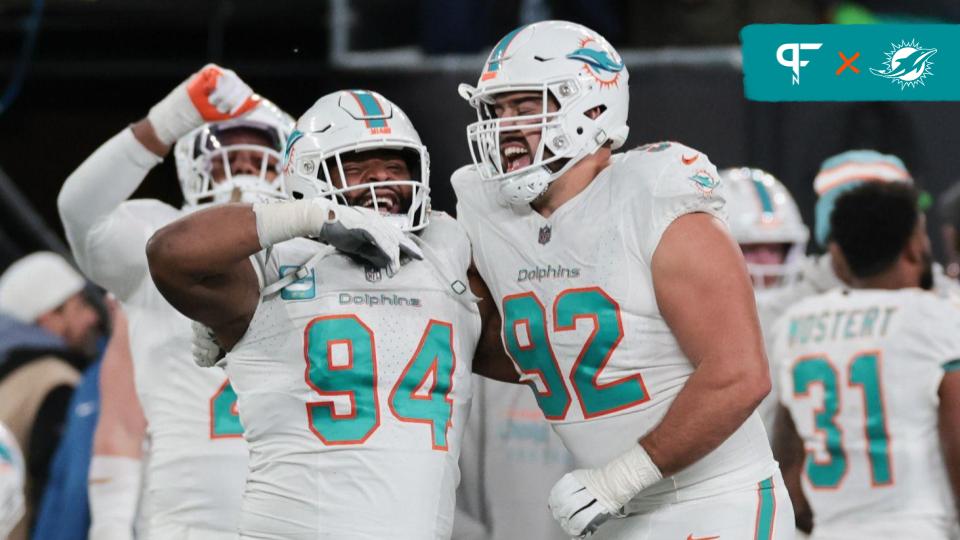Miami Dolphins defensive tackle Christian Wilkins (94) and defensive tackle Zach Sieler (92) celebrate after a defensive stop during the second half against the New York Jets at MetLife Stadium.