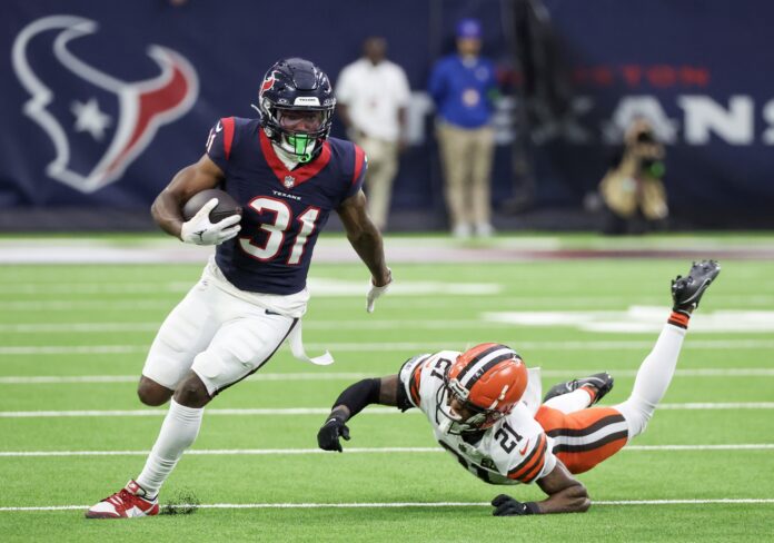 Houston Texans running back Dameon Pierce (31). Breaks the tackle of Cleveland Browns cornerback Denzel Ward (21) in the second quarter at NRG Stadium. Mandatory Credit: Thomas Shea-USA TODAY Sports