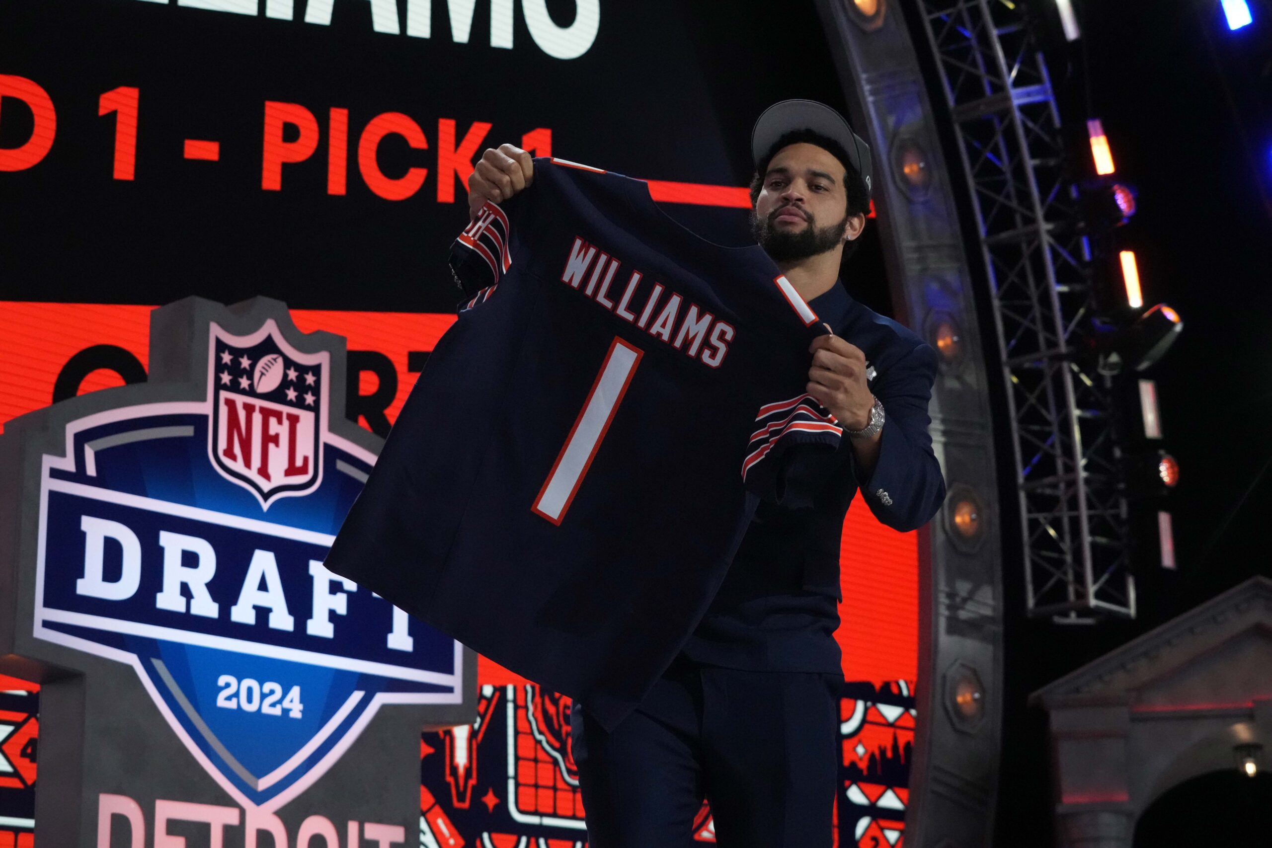 Southern California Trojans quarterback Caleb Williams poses with jersey after being chosen as the No. 1 pick in the first round during the 2024 NFL Draft at Campus Martius Park and Hart Plaza.