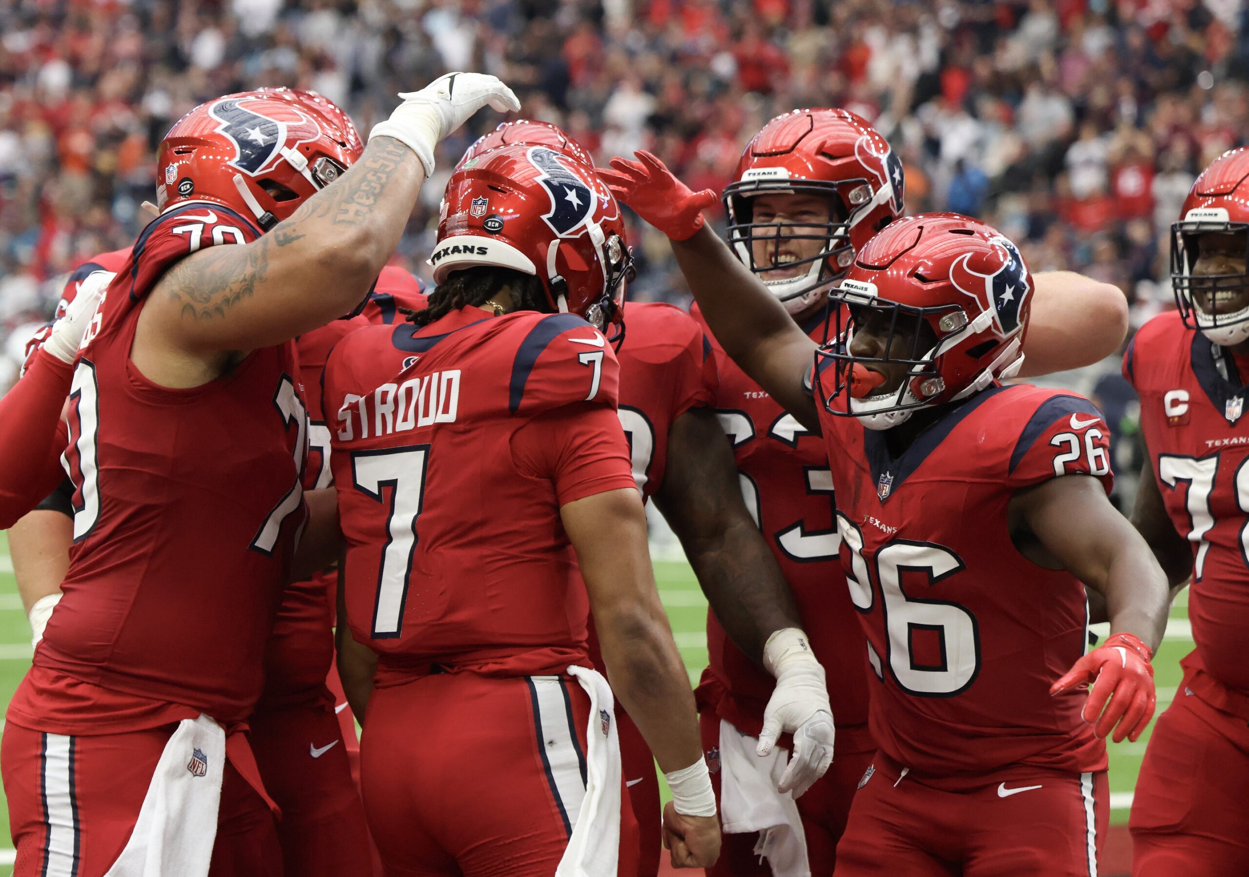Houston Texans quarterback C.J. Stroud (7) and teammates celebrate a touchdown against the Jacksonville Jaguars in the second half at NRG Stadium. Mandatory Credit: Thomas Shea-USA TODAY Sports