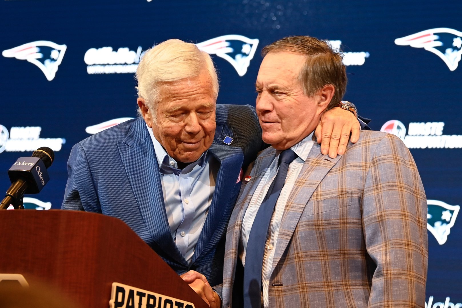 New England Patriots former head coach Bill Belichick (right) embraces Patriots owner Robert Kraft (left) during a press conference at Gillette Stadium to announce Belichick's exit from the team.