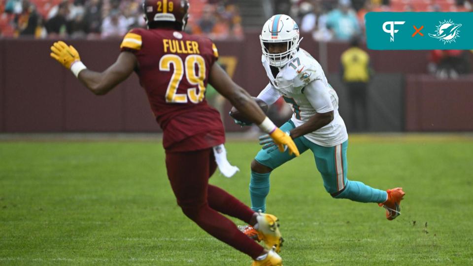 Miami Dolphins wide receiver Jaylen Waddle (17) runs after a catch as Washington Commanders cornerback Kendall Fuller (29) looks on during the second half at FedExField.