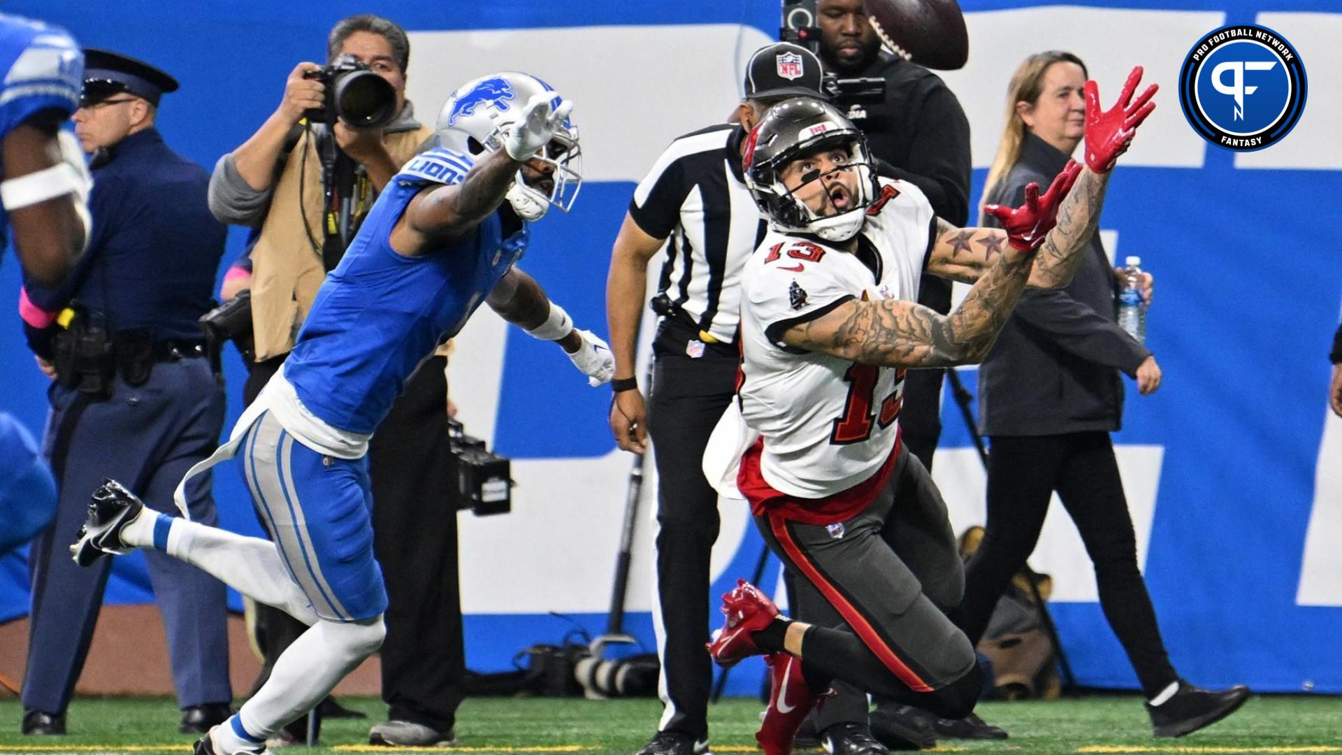 Tampa Bay Buccaneers wide receiver Mike Evans (13) reaches for the ball against the Detroit Lions during the first half in a 2024 NFC divisional round game at Ford Field.