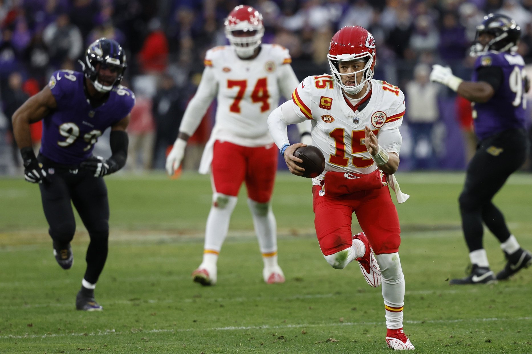 Kansas City Chiefs QB Patrick Mahomes (15) runs with the ball against the Baltimore Ravens.