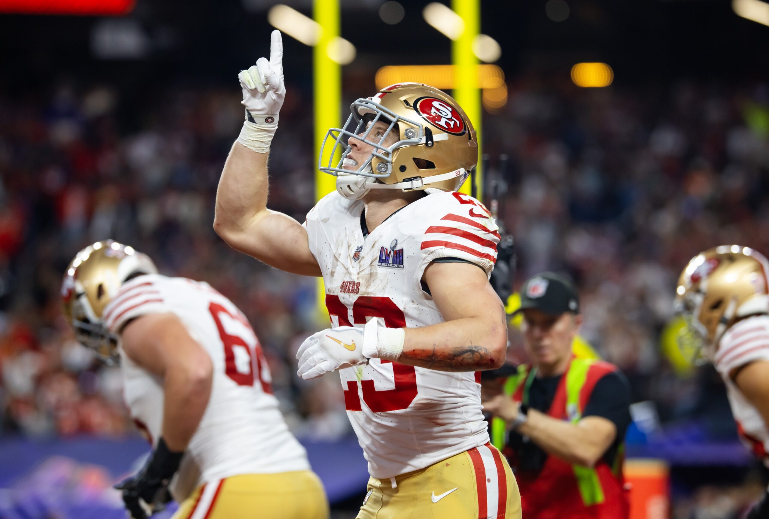 San Francisco 49ers running back Christian McCaffrey (23) celebrates after scoring a touchdown in the first half of Super Bowl LVIII at Allegiant Stadium.