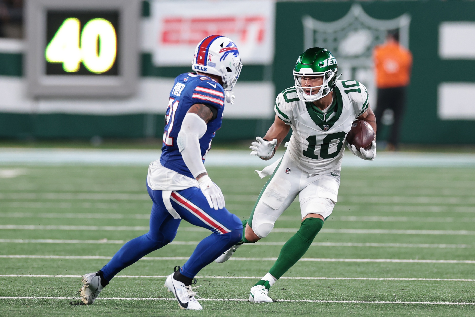 New York Jets wide receiver Allen Lazard (10) makes a catch over Buffalo Bills safety Jordan Poyer (21) during the second half at MetLife Stadium. Mandatory Credit: Vincent Carchietta-USA TODAY Sports